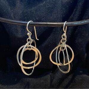 Triple circle dangling silver earrings.